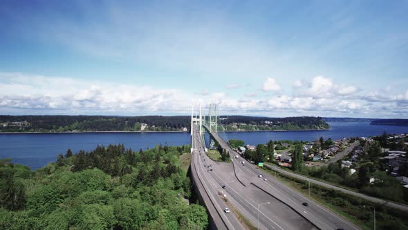 Daily commuters travel across the Tacoma Narrows Bridge, crossing Puget Sound, aerial