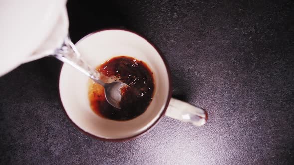 instant coffee is poured with boiling water
