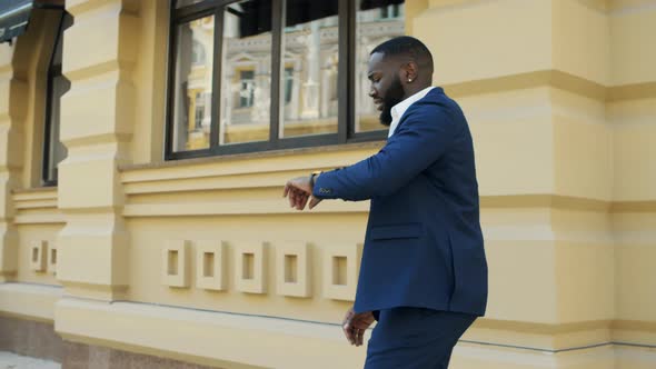 Young Businessman Running in Hurry