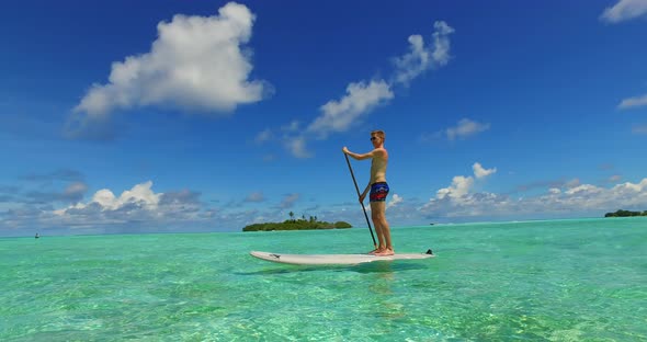 Beautiful lady and man on romantic honeymoon have fun on beach on white sand background 4K