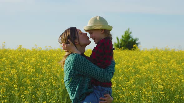 Farmer Family Funny a Mother Holds Daughter in Her Arms Little Girl