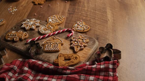 Decorated Gingerbread Figures on Wooden Board