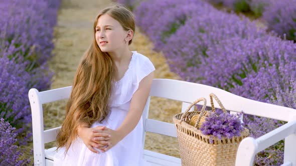 Girl Sitting on a Bench