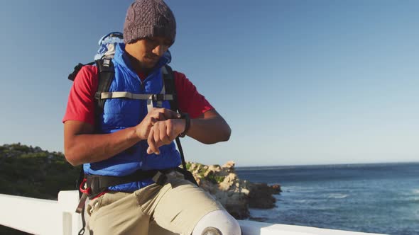 Sporty mixed race man with prosthetic leg enjoy his hike