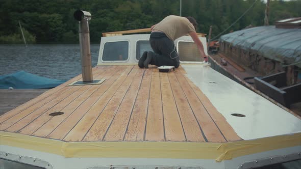 Painting wooden planked boat roof timelapse