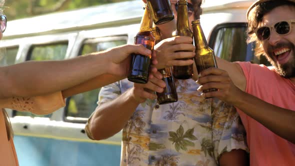 Group of hipster friends toasting together