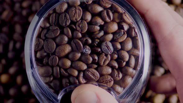 Closeup Coffee Seeds Grinding in Electrical Grinder Top View