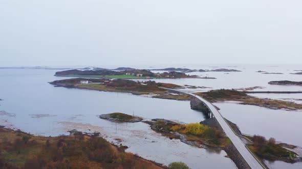 Atlantic Ocean Road And Norwegian Sea On A Misty Morning With Rocky Islands In Norway. - aerial