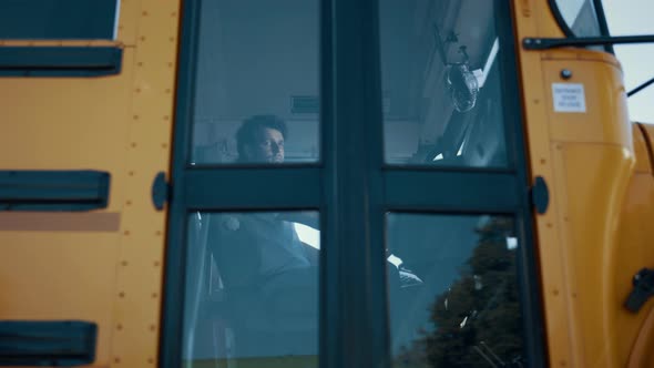 Man Driver Sitting Schoolbus Cabin Alone