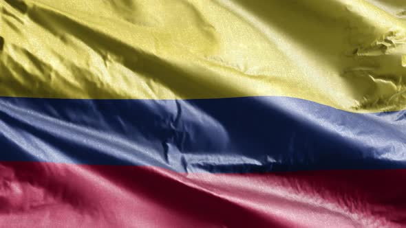 Colombia textile flag waving on the wind. Slow motion. 20 seconds loop.