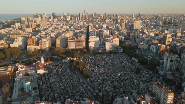 Aerial establishing shot of La Recoleta Cemetery and downtown Buenos Aires on background