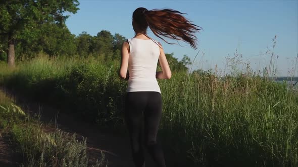 Young Sport Woman Jogging on the Nature