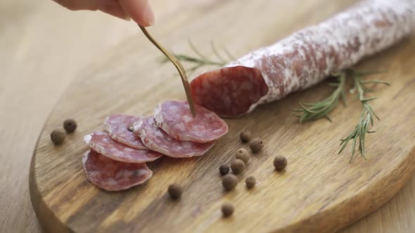 Salami and Chorizo Sausage Close Up on Dark Concrete Background