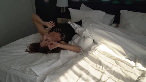 Young Woman Slipped and Lies in Bed