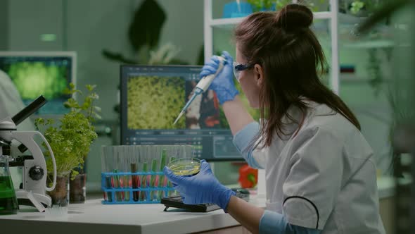 Chemist Woman Taking Dna Liquid From Test Tube with Micropipette