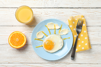 Breakfast of fried egg and orange juice on wooden background, top view / Photodune, Misc