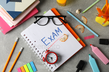 Inscription Exam and different stationary on grey background, top view / Photodune, Misc