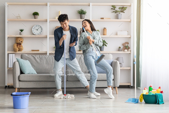 Funny asian couple singing songs while cleaning apartment, full length / Photodune, Misc