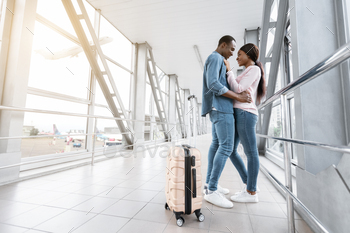 Couple In Airport. Romantic Black Lovers Embracing In Terminal Corridor / Photodune, Misc