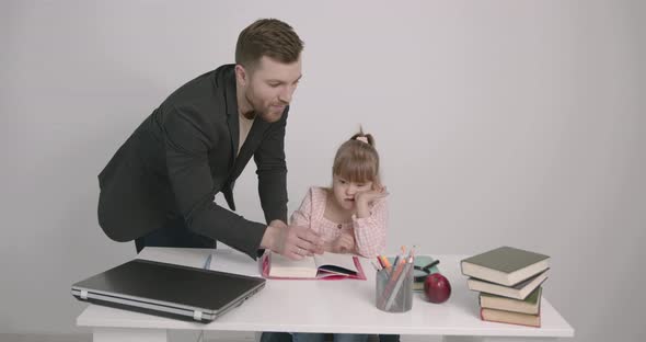 Father Learning with Special Needs Daughter at Home