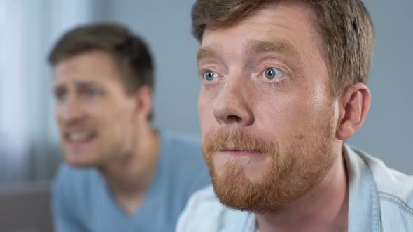 Excited Male Friends Watching Football Match on Tv, Cheering and Supporting Team