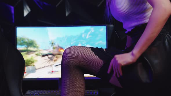 Blonde Sexy Gamer Girl Streamer Tightens Up Her Fishnets Stockings and Looking in the Camera