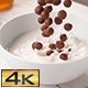 Chocolate Ball-Shaped Cereals Falling into Bowl with Milk - VideoHive Item for Sale