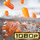 Baby Carrots Falling into Pot with Boiling Water - VideoHive Item for Sale