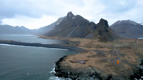 Iceland Coastline East Fjords crashing waves over coast with lighthouse