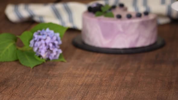 Piece of Layered Berry Mousse Cake With Mirror Glaze.