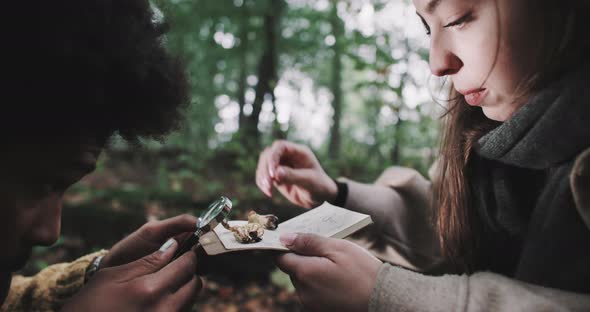 Man and Woman examine specimens