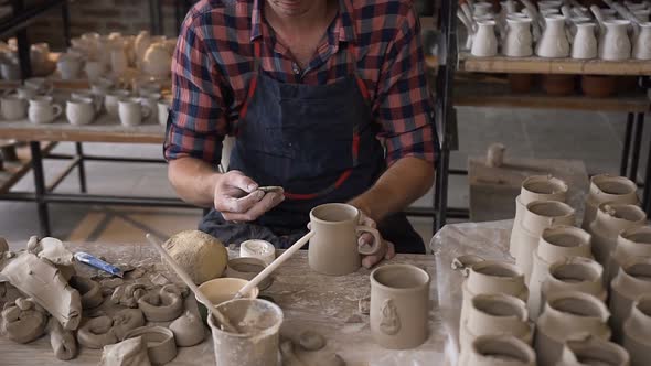 Talanted Caucasian Man Making Decoration for Cap