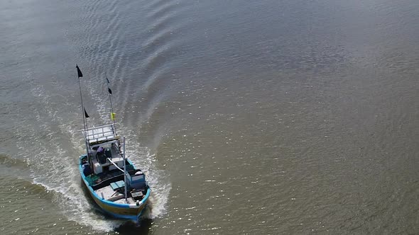 Flyover A Fishing Boat On The River