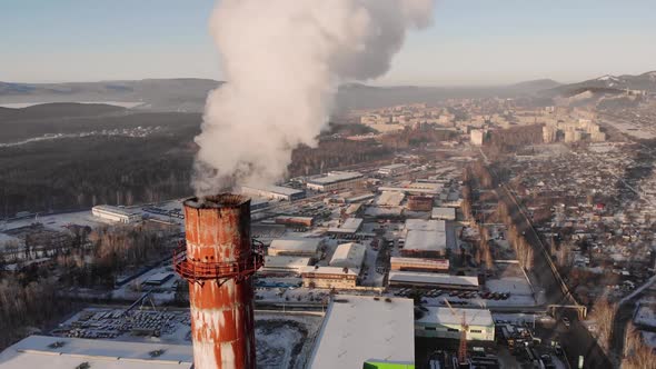 Aerial Drone Footage of Steel Factory Pipes During Sunset Time