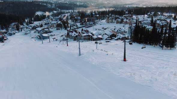 Ski Resort with Modern Chairlift and Small Hotel Buildings