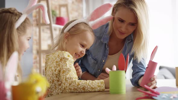 Handheld video of mother and daughters playing with Easter toys. Shot with RED helium camera in 8K.