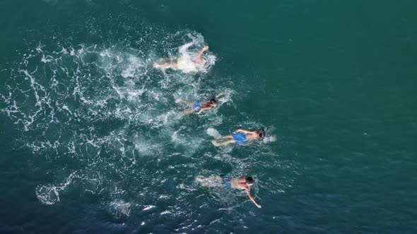 Children Swimming In The Sea