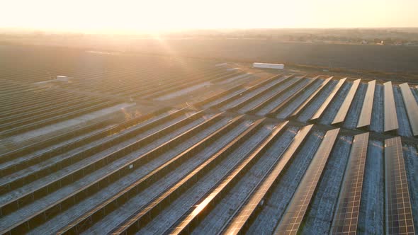 Aerial View of Solar Panels Stand in a Row in the Fields Power Ecology Innovation Nature Environment