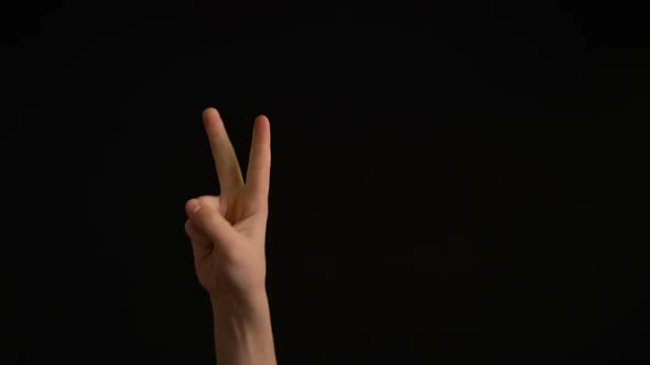 Boy Hand Counting From Zero To Five Isolated on Black Background