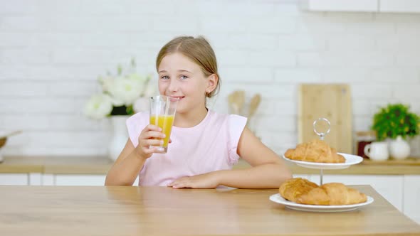 Girl Drinking Orange Juice