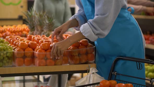 Hands of Female Supermarket Employee During Work