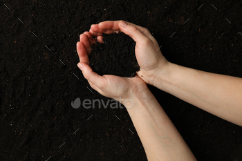 Woman hold soil on soil background, top view / Photodune, Misc