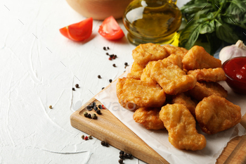 Composition with chicken nuggets, ketchup and potato on white background / Photodune, Misc