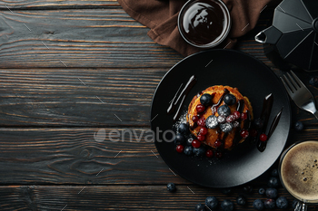 Composition with pancakes and cocoa drink on wooden table. Sweet breakfast / Photodune, Misc