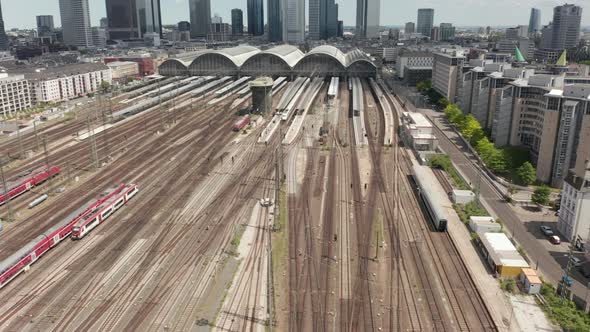 AERIAL: Forward Flight Over Frankfurt Am Main, Germany Central Train Station Train Tracks on