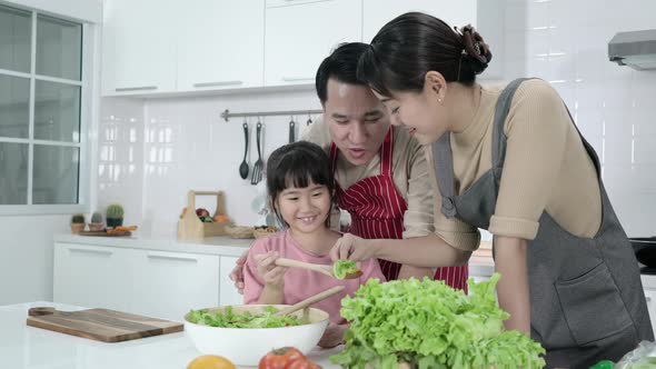 Family cooking in kitchen