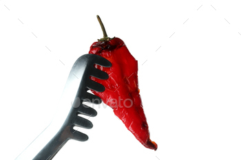 Tongs with grilled chilli pepper isolated on white background / Photodune, Misc