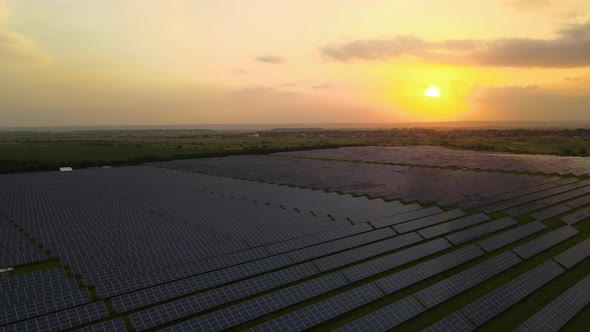 Aerial View of Big Sustainable Electric Power Plant with Many Rows of Solar Photovoltaic Panels for