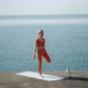 Female Doing Natarajasana Pose Near Sea - VideoHive Item for Sale