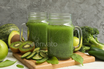 Concept of healthy food with smoothie, vegetables and fruits on wooden table / Photodune, Misc